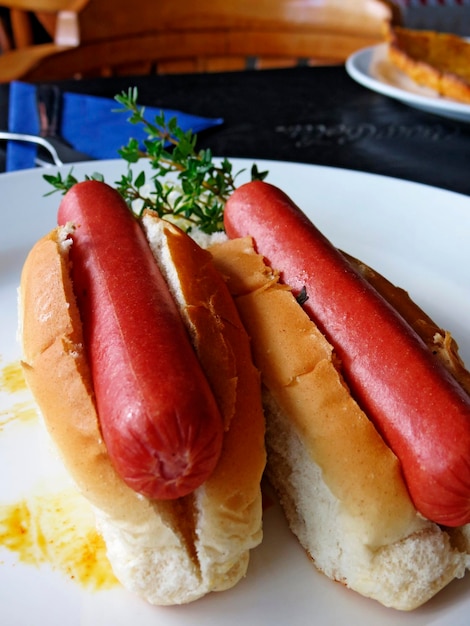 A Close Up Of A Hot Dog On A Plate With Text Overlay That Reads Crowd