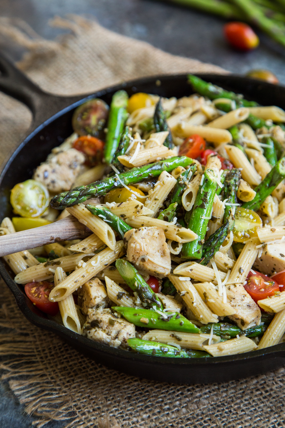 A Skillet Filled With Pasta And Tomatoes