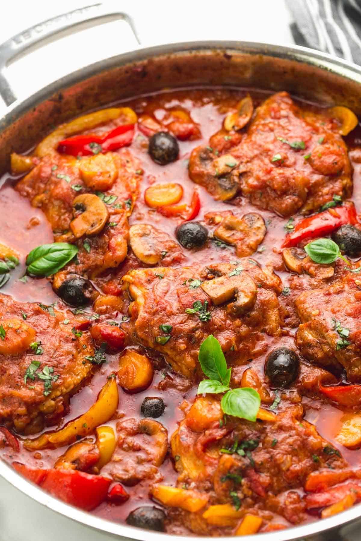 Classic Italian Chicken Cacciatore Cooked In A Rich Tomato Sauce With