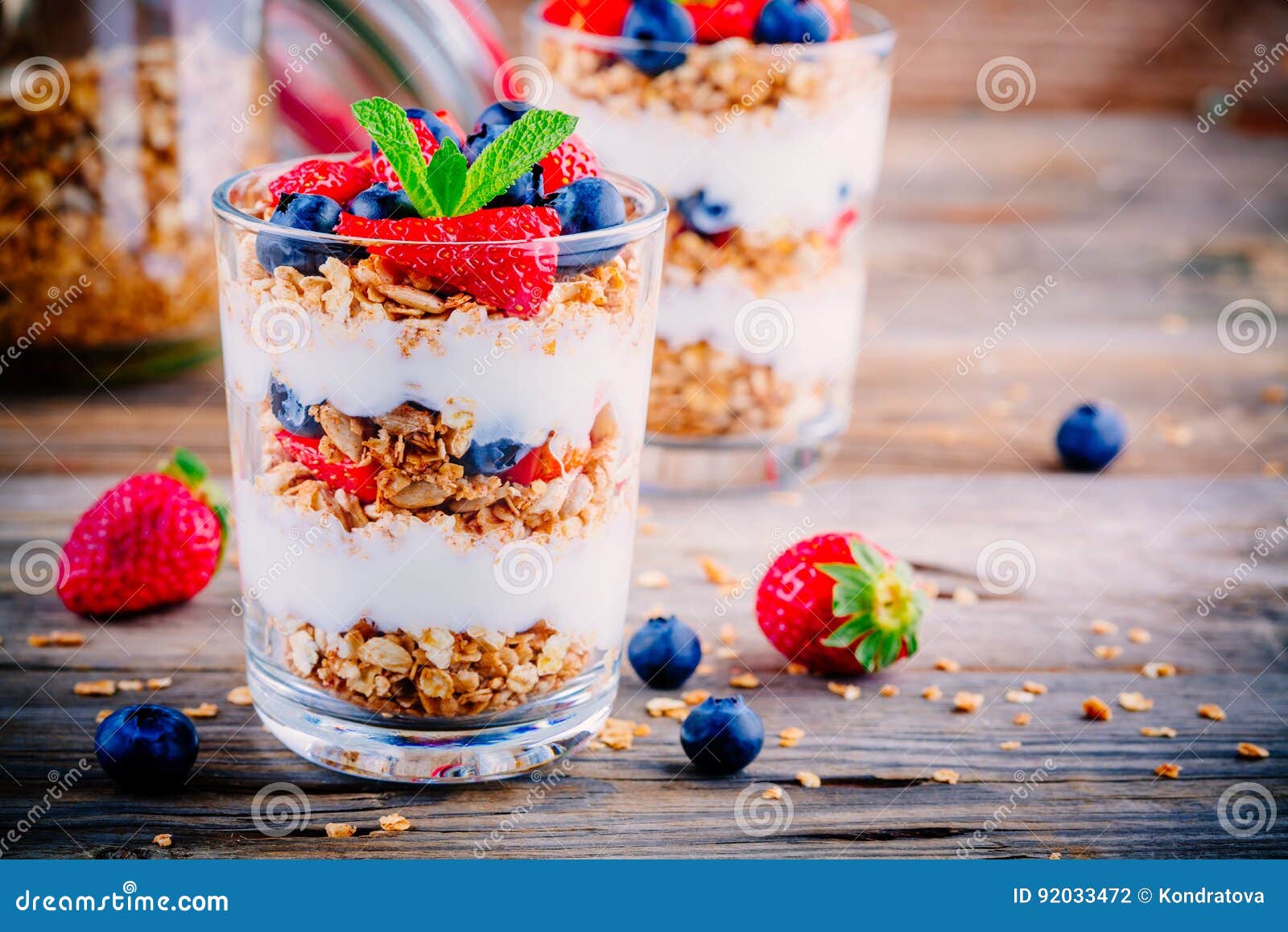 Close Up Image Of A Greek Yogurt Parfait With Blueberries Strawberries And Granola In A