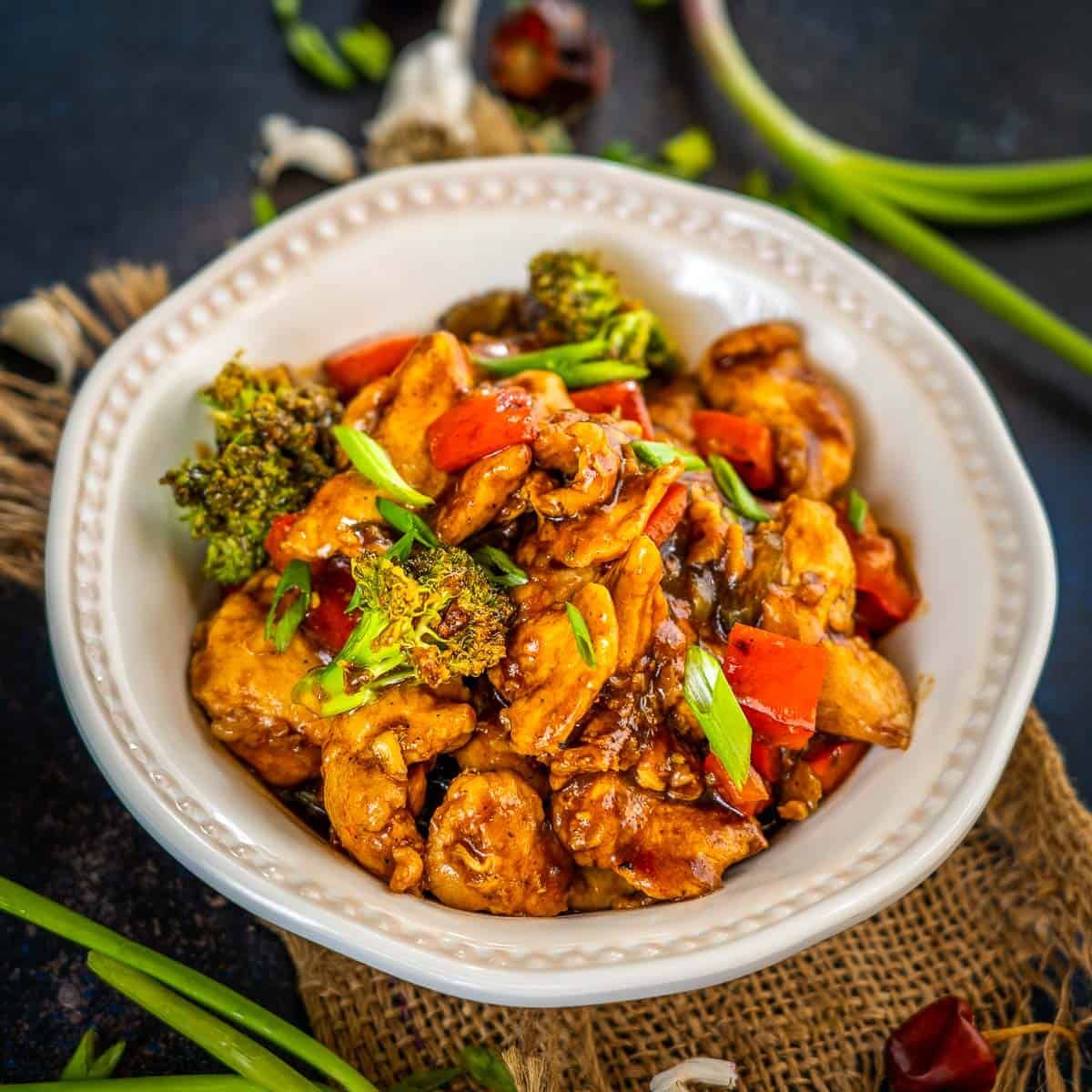 Closeup Of Hunan Chicken In A Wok Before Serving Showing Juicy Slices