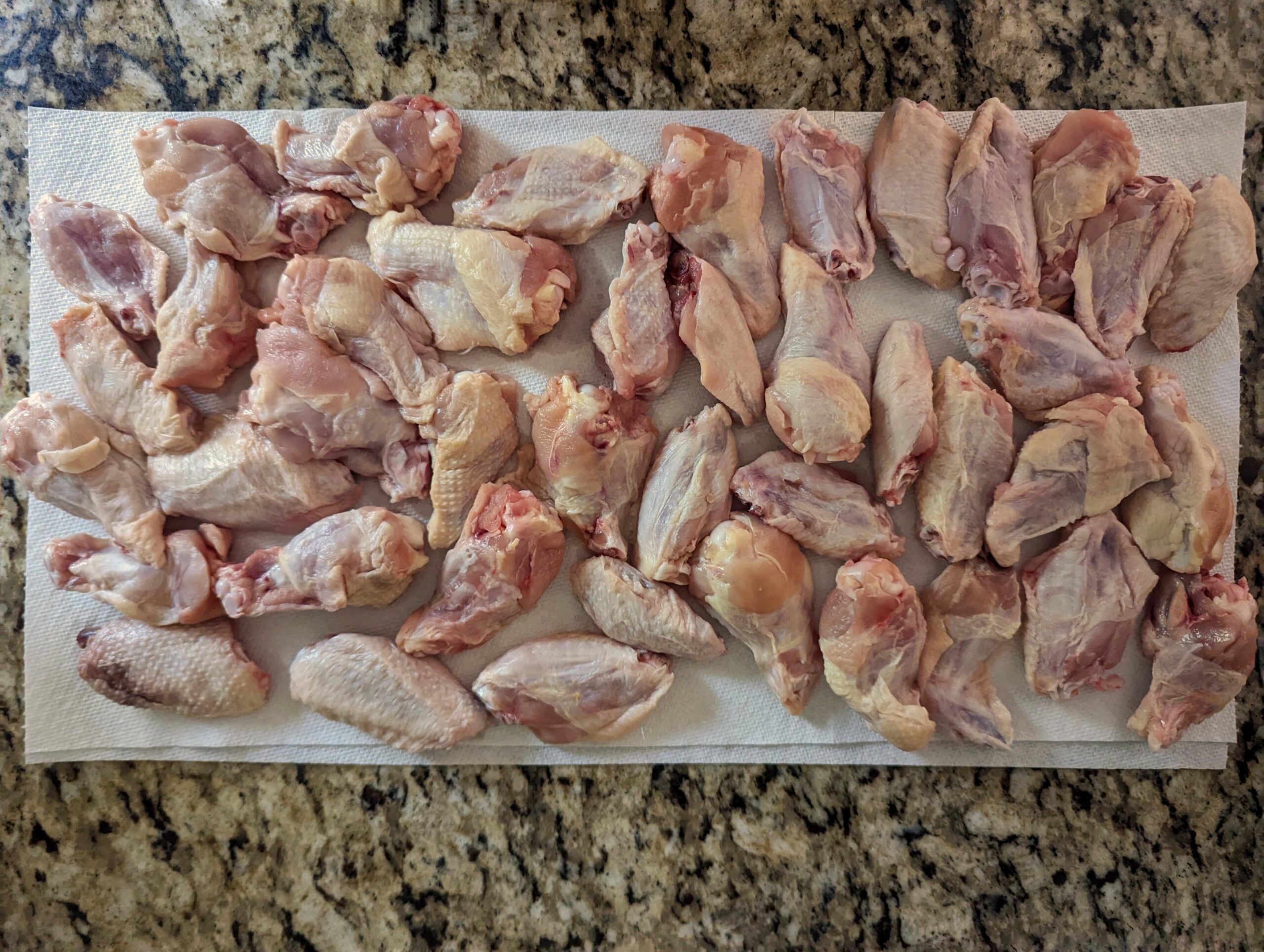 Crispy Baked Chicken Wings On A Platter Served With Hot Sauce Celery