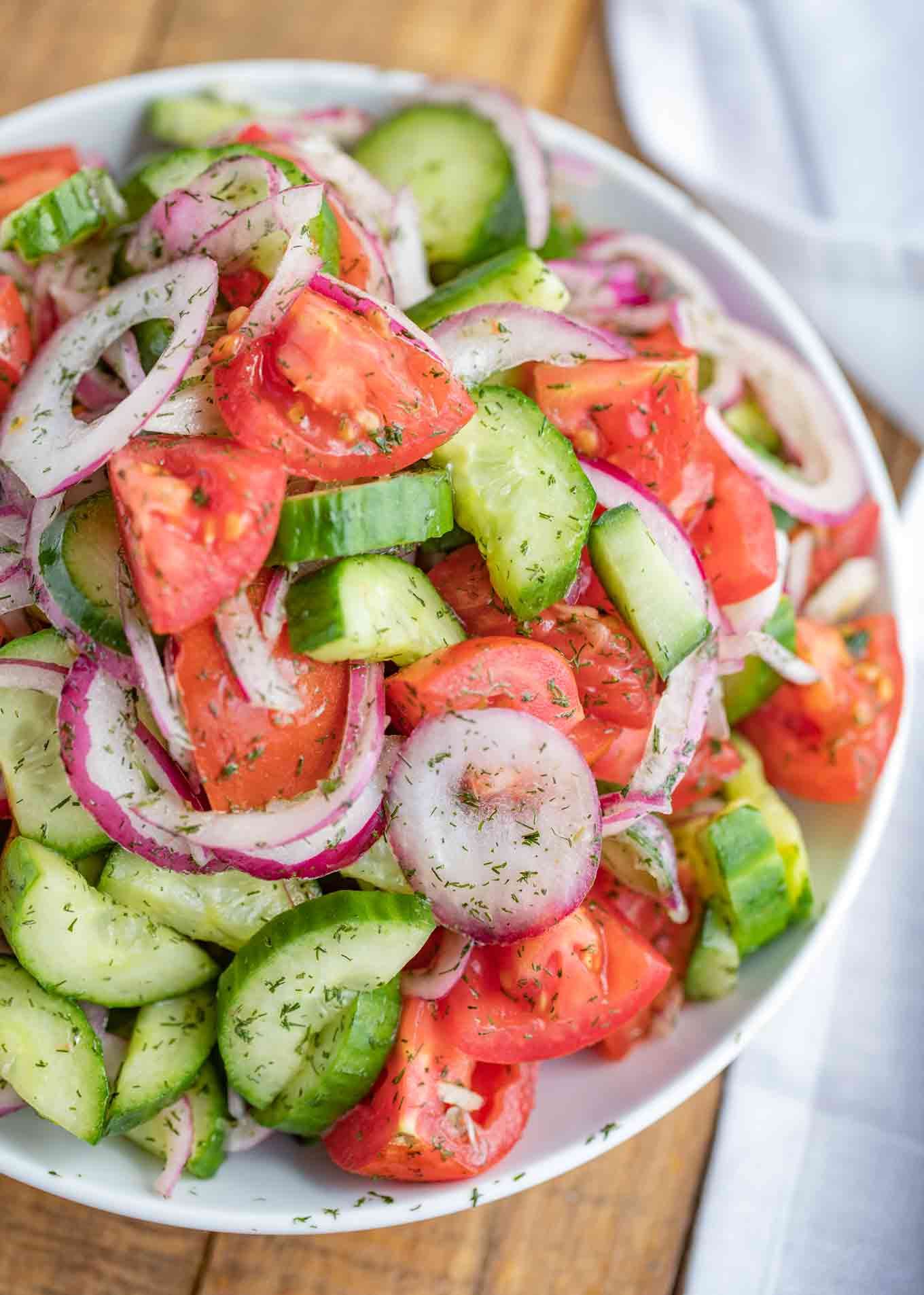 Cucumber Tomato Salad Seasoned With Dill And Fresh Basil In A Homemade