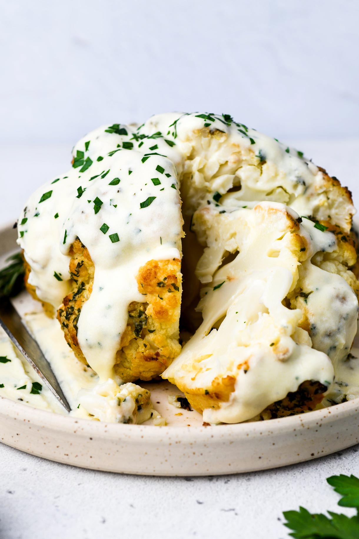 Delicious Whole Roasted Cauliflower Recipe With Cheese Sauce