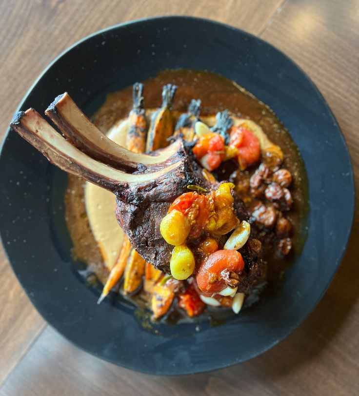 Double Cut Elk Chop With Tomato Confit Parsnip Puree Roasted Carrots