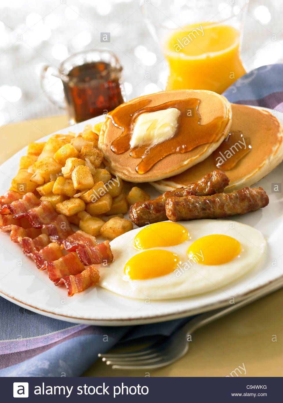 Download This Stock Image Pancake Breakfast With Eggs Bacon Sausage Potatoes And Orange