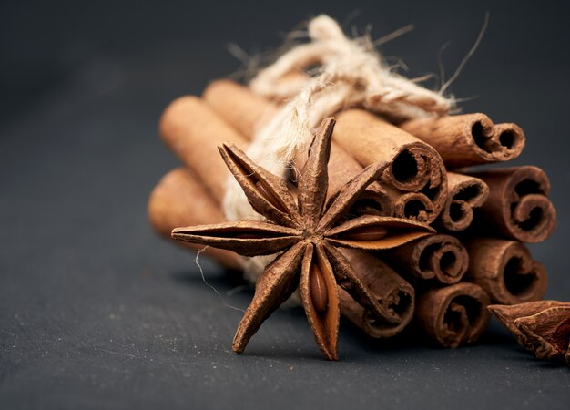 Dry Star Anise With A Bunch Of Brown Cinnamon Sticks Tied With A Rope