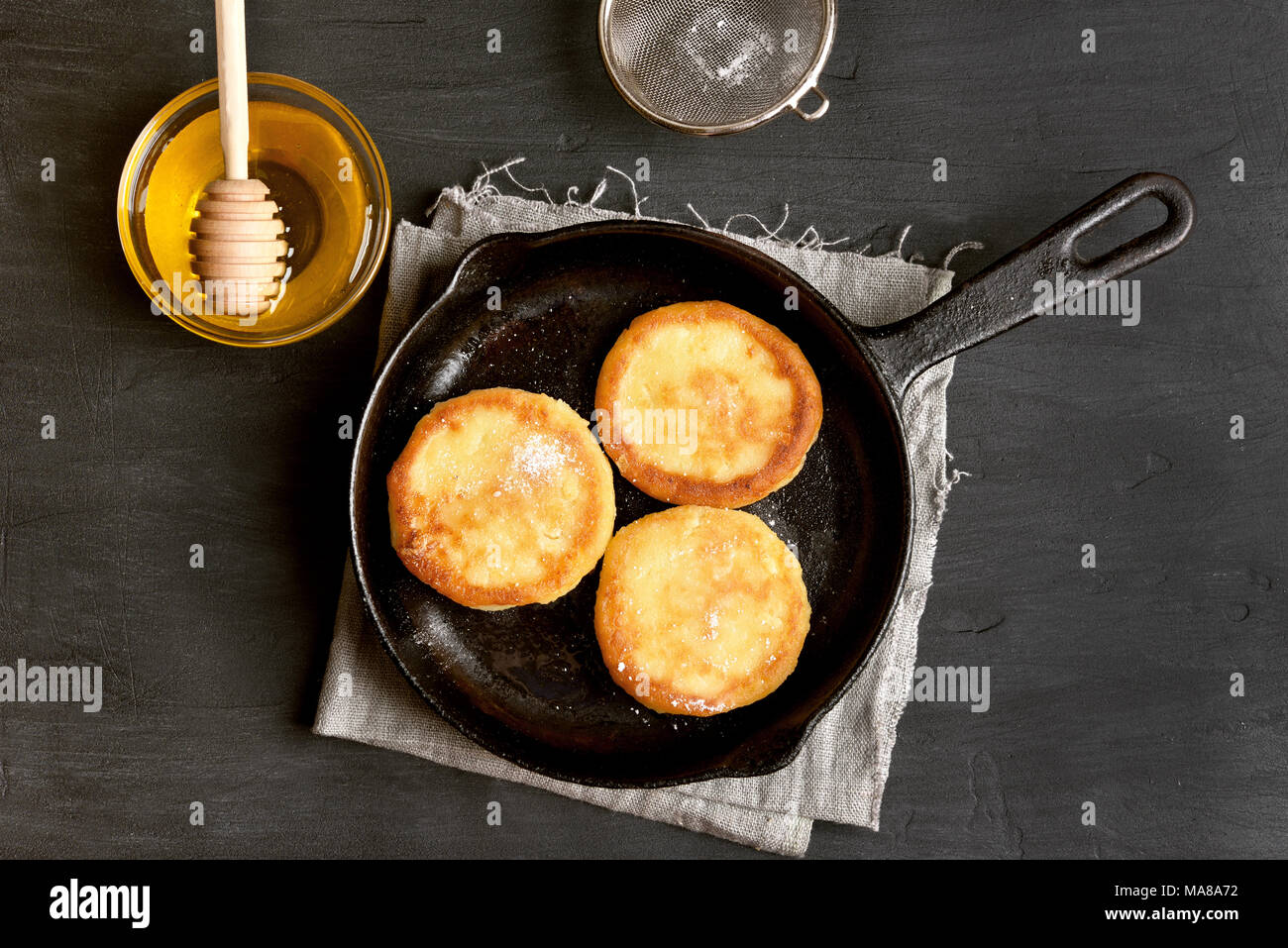 Fritters Curd Cheese Pancakes In Cast Iron Pan Over Black Stone