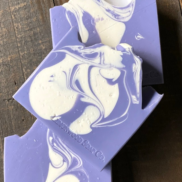 Homemade Soap Bar With Lavender On Top And The Words How To Make