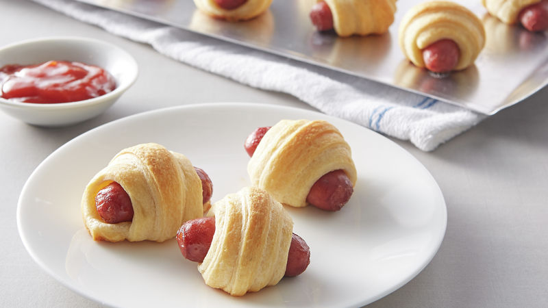 It S Easy Hot Dogs Wrapped In Pillsbury Crescent Rolls Covered In