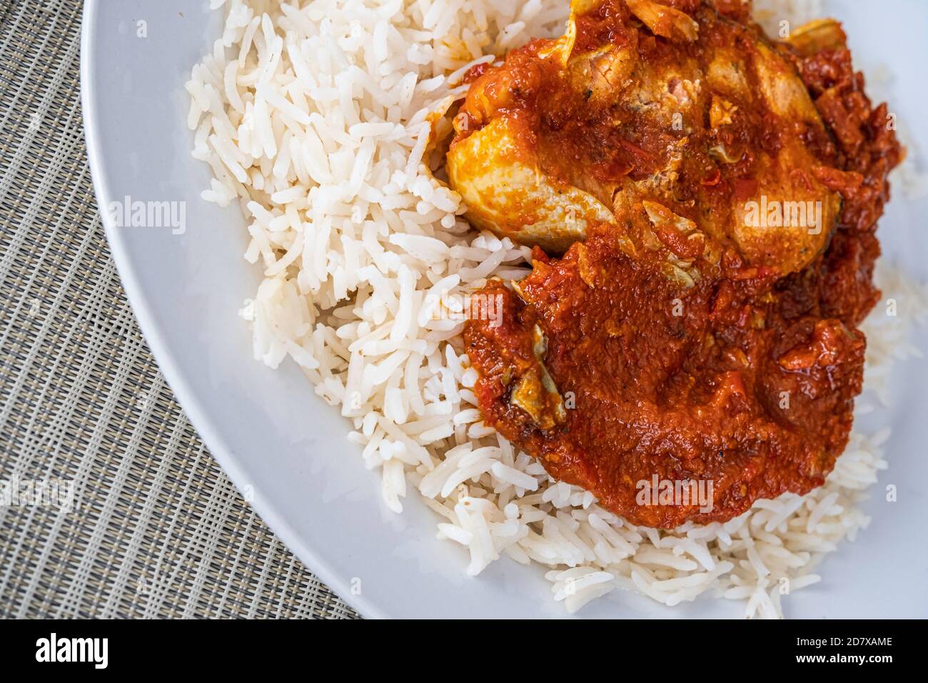 Nigerian Fish Tomato Pepper Sauce With Rice Ready To Eat Stock Photo