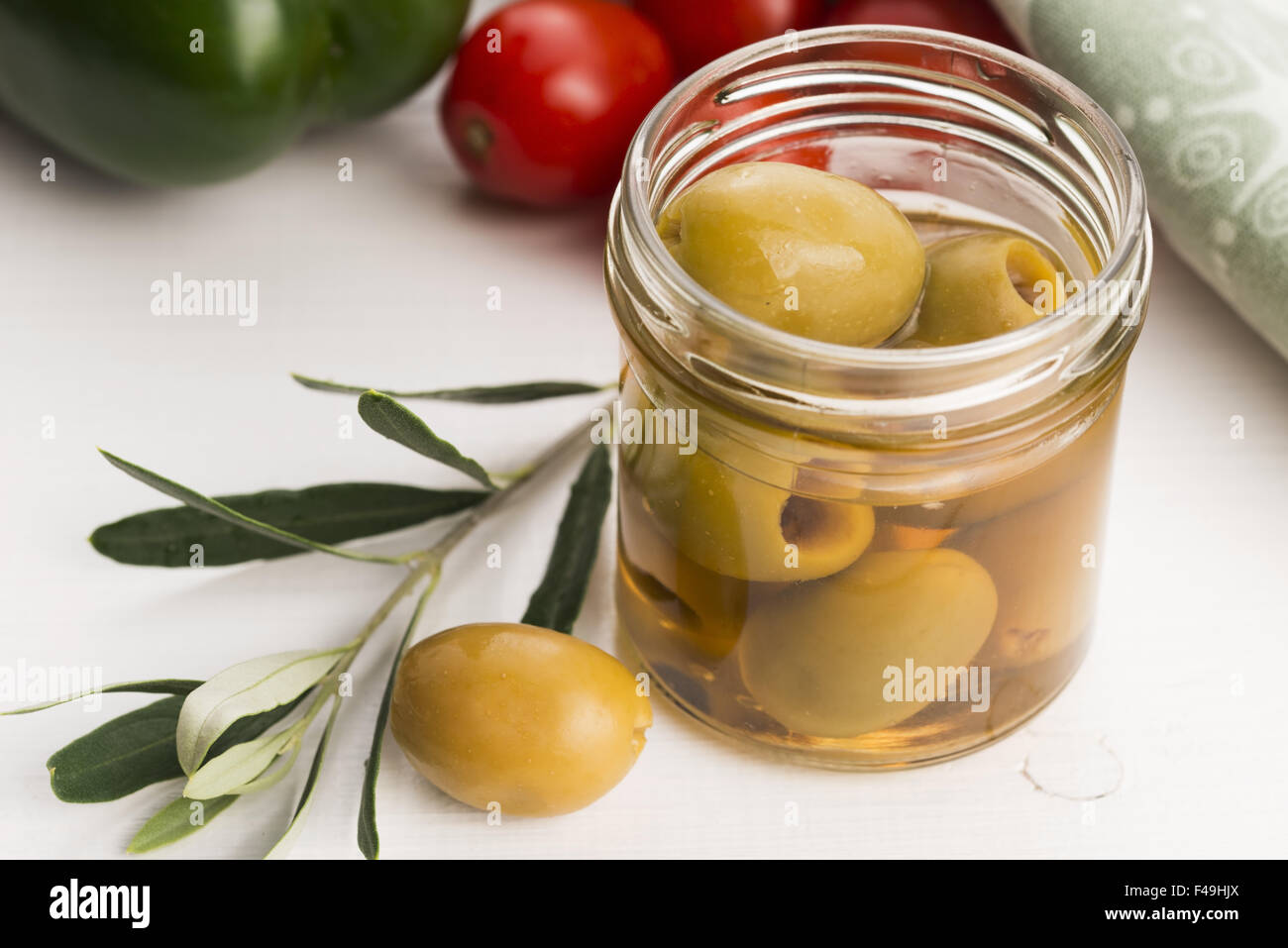 Pickled Olives And Olive Tree Branch Stock Photo Alamy