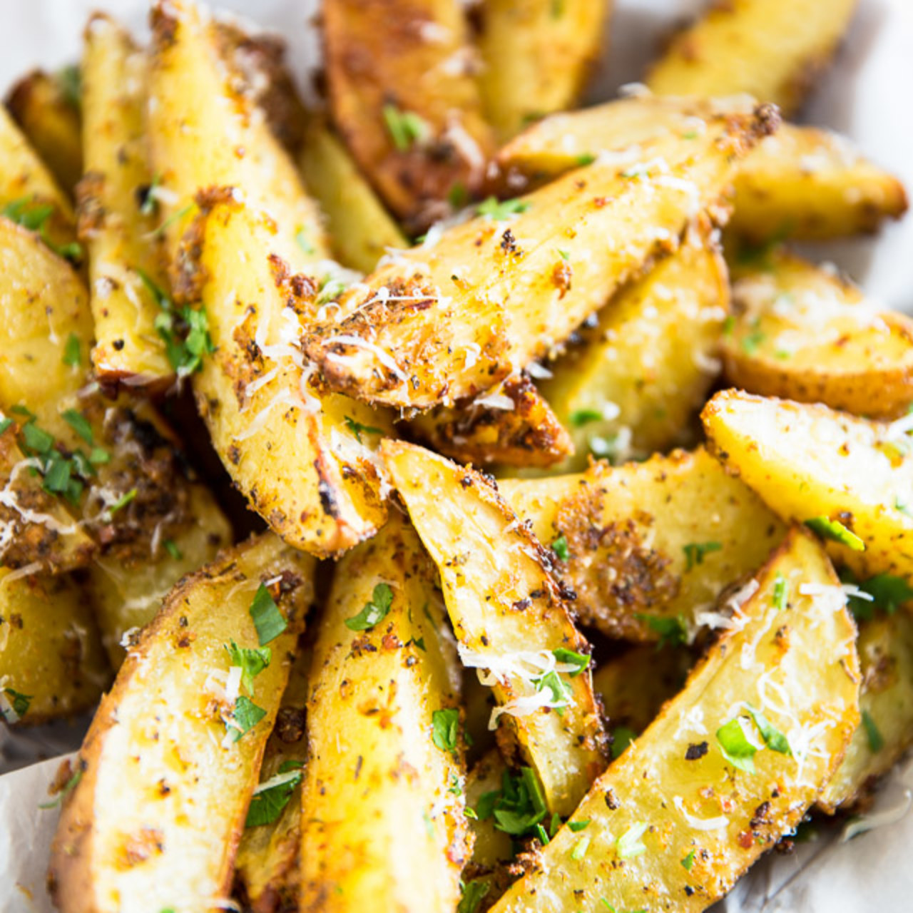 This Easy Recipe For Baked Garlic Parmesan Potato Wedges Will Blow You