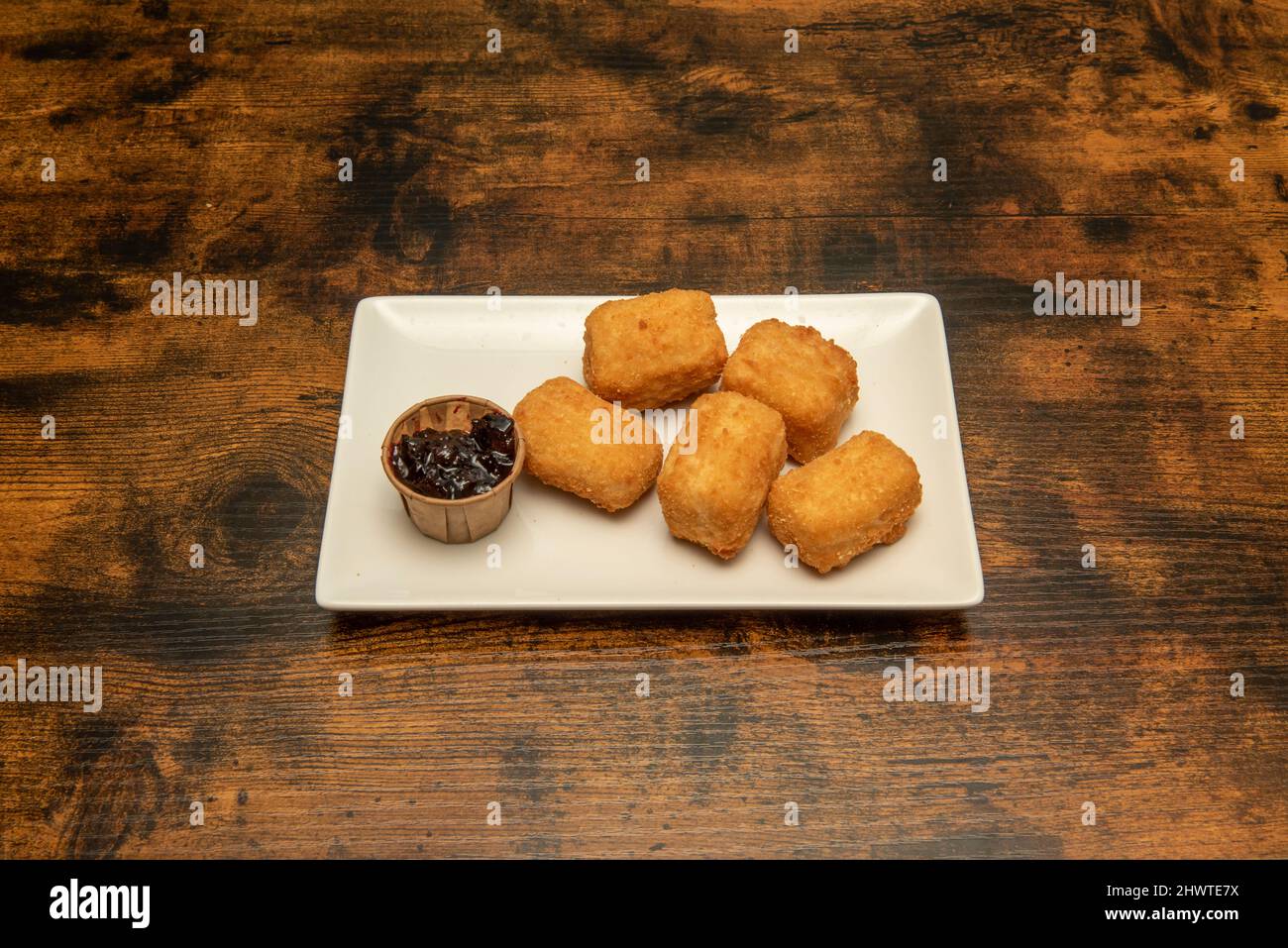 This Simple Recipe For Battered Brie Cheese Accompanied By Blueberry