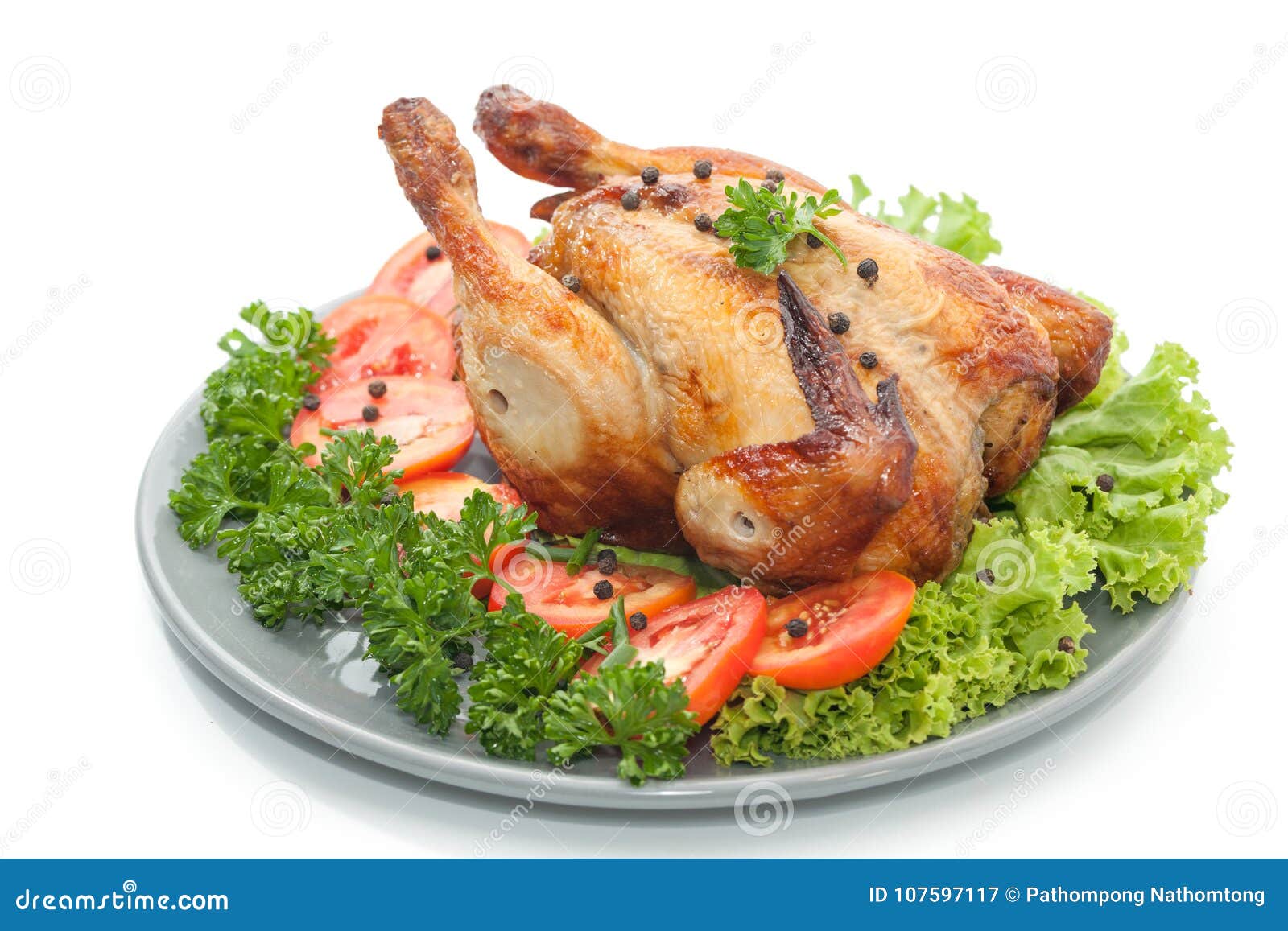 Two Pieces Of Grilled Chicken On A Yellow Plate With Tomatoes And